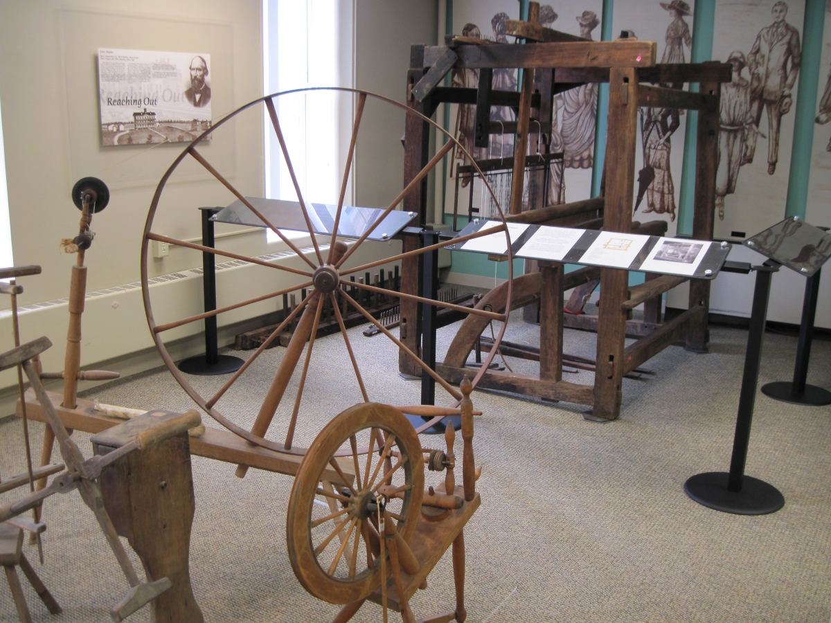 Display of large pioneer loom & other exhibits at the Cattaraugus County Museum