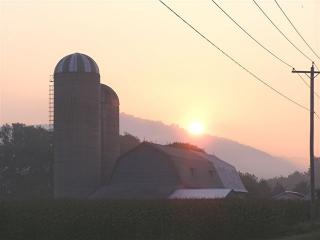 Sunrise over barn in Great Valley, August 2006. Photo Credit Rick Miller