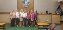 Some ladies from The Pink Pumpkin Project with legislator Kelly Andreano